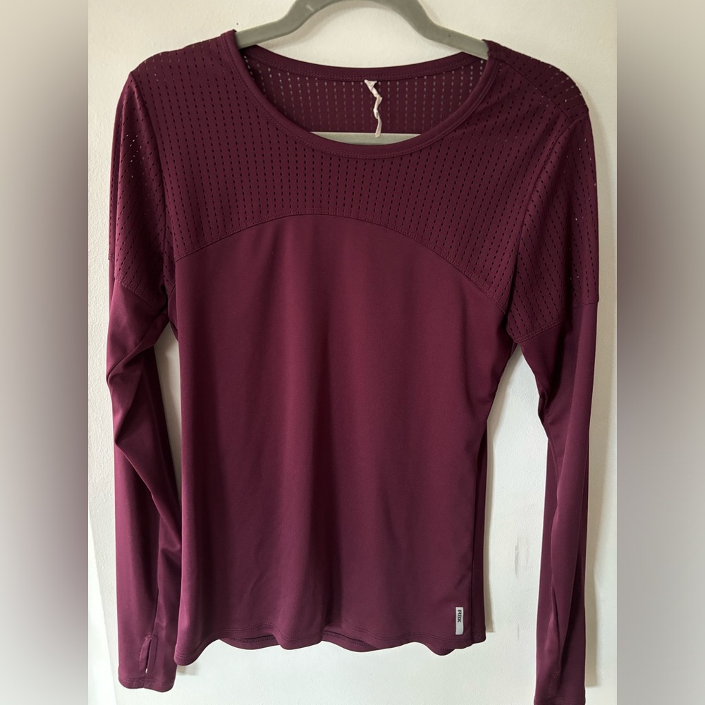 Purple workout shirt with mesh on top. Long sleeve with some holes.